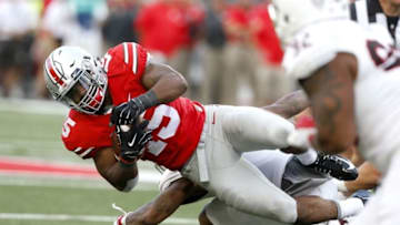Sep 19, 2015; Columbus, OH, USA; Ohio State Buckeyes running back Ezekiel Elliott (15) dives for the first down versus Northern Illinois Huskies during the second half at Ohio Stadium. The Ohio State Buckeyes won 20-13. Mandatory Credit: Joe Maiorana-USA TODAY Sports