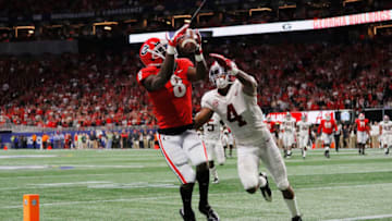 ATLANTA, GA - DECEMBER 01: Riley Ridley #8 of the Georgia Bulldogs catches a touchdown pass against Saivion Smith #4 of the Alabama Crimson Tide in the third quarter during the 2018 SEC Championship Game at Mercedes-Benz Stadium on December 1, 2018 in Atlanta, Georgia. (Photo by Kevin C. Cox/Getty Images)