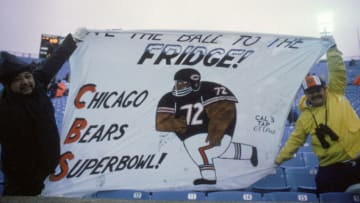 CHICAGO - 1985: Fans of defensive lineman William Perry #72 of the Chicago Bears display a banner which reads "Give the Ball to the Fridge" during a game between the Bears and the Detroit Lions in 1985 at Soldier Field in Chicago, Illinois. The Bears won 23-3. (Photy by Mike Powell/Getty Images)