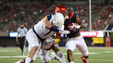 Sep 7, 2019; Tucson, AZ, USA; Arizona Wildcats running back Bam Smith (20) is knocked out of bounds by Northern Arizona Lumberjacks linebacker Carson Taylor (1) and Northern Arizona Lumberjacks linebacker Brooklyn Hardiman (35) during the first half at Arizona Stadium. Mandatory Credit: Joe Camporeale-USA TODAY Sports