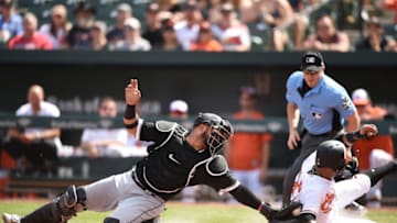 BALTIMORE, MD - SEPTEMBER 16: Jonathan Villar #2 of the Baltimore Orioles beats the tag by Welington Castillo #21 of the Chicago White Sox on a DJ Stewart #63 (not pictured) fielders choice in the first inning during a baseball game at Oriole Park at Camden Yards on September 16, 2018 in Baltimore, Maryland. (Photo by Mitchell Layton/Getty Images)