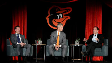BALTIMORE, MD - NOVEMBER 19: Louis Angelos (L) and John Angelos (R) of the Baltimore Orioles look on after introducing Mike Elias (C) to the media as the Orioles Executive Vice President and General Manager during a news conference at Oriole Park at Camden Yards on November 19, 2018 in Baltimore, Maryland. (Photo by Rob Carr/Getty Images)