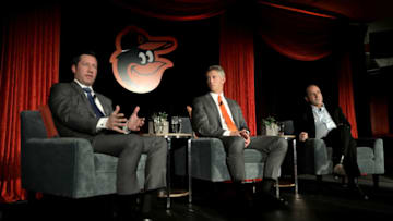 BALTIMORE, MD - NOVEMBER 19: Louis Angelos (L) and John Angelos (R) of the Baltimore Orioles look on after introducing Mike Elias (C) to the media as the Orioles Executive Vice President and General Manager during a news conference at Oriole Park at Camden Yards on November 19, 2018 in Baltimore, Maryland. (Photo by Rob Carr/Getty Images)