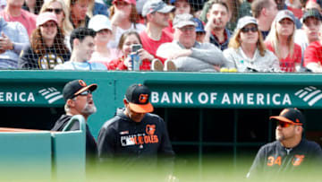 BOSTON, MASSACHUSETTS - APRIL 14: Pitching coach Doug Brocail #26 of the Baltimore Orioles, left, is ejected from the game against the Boston Red Sox in the bottom of the sixth inning at Fenway Park on April 14, 2019 in Boston, Massachusetts. (Photo by Omar Rawlings/Getty Images)