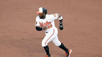 BALTIMORE, MD - MAY 07: Dwight Smith Jr. #35 of the Baltimore Orioles runs to second base during a baseball game against the Boston Red Sox at Oriole Park at Camden Yards on May 7, 2019 in Baltimore. Maryland. (Photo by Mitchell Layton/Getty Images)