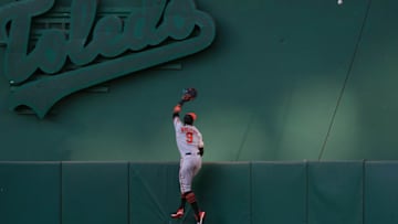 OAKLAND, CA - JUNE 18: Keon Broxton #9 of the Baltimore Orioles leaps at the wall and watches the ball go over for a solo home run off the bat of Beau Taylor #46 of the Oakland Athletics in the bottom of the third inning of a Major League Baseball game at Oakland-Alameda County Coliseum on June 18, 2019 in Oakland, California. (Photo by Thearon W. Henderson/Getty Images)
