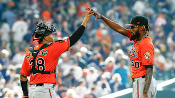 HOUSTON, TEXAS - JUNE 08: Miguel Castro #50 of the Baltimore Orioles high fives Pedro Severino #28 after the final out against the Houston Astros at Minute Maid Park on June 08, 2019 in Houston, Texas. (Photo by Bob Levey/Getty Images)