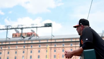 BALTIMORE, MD - JULY 14: Manager Brandon Hyde #18 of the Baltimore Orioles looks on during the game against the Tampa Bay Rays at Oriole Park at Camden Yards on July 14, 2019 in Baltimore, Maryland. (Photo by Will Newton/Getty Images)