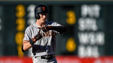 DENVER, CO - JULY 16: Mike Yastrzemski #5 of the San Francisco Giants signals to the dugout after hitting an RBI double in the second inning against the Colorado Rockies at Coors Field on July 16, 2019 in Denver, Colorado. (Photo by Dustin Bradford/Getty Images)