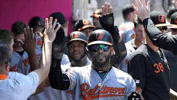 ANAHEIM, CA - JULY 28: Jonathan Villar #2 of the Baltimore Orioles followed by Hanser Alberto #57 are congraulated after being driven in by Trey Mancini #16 in the fifth inning against the Los Angeles Angels of Anaheim at Angel Stadium of Anaheim on July 28, 2019 in Anaheim, California. (Photo by John McCoy/Getty Images)