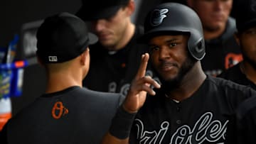 BALTIMORE, MD - AUGUST 24: Hanser Alberto #57 of the Baltimore Orioles celebrates after scoring on a wild pitch during the first inning against the Tampa Bay Rays at Oriole Park at Camden Yards on August 24, 2019 in Baltimore, Maryland. All players across MLB will wear nicknames on their backs as well as colorful, non-traditional uniforms featuring alternate designs inspired by youth-league uniforms during Players Weekend. (Photo by Will Newton/Getty Images)