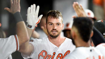 BALTIMORE, MD - SEPTEMBER 17: Trey Mancini #16 of the Baltimore Orioles celebrates with teammates after hitting a two-run home run in the first inning against the Toronto Blue Jays at Oriole Park at Camden Yards on September 17, 2019 in Baltimore, Maryland. (Photo by Greg Fiume/Getty Images)