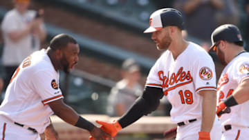 BALTIMORE, MD - SEPTEMBER 22: Chris Davis #19 of the Baltimore Orioles celebrates a home run in the eighth inning with Alberto Hanser #57 during a baseball game against the Seattle Mariners at Oriole Park at Camden Yards on September 22, 2019 in Baltimore, Maryland. (Photo by Mitchell Layton/Getty Images)