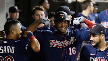 CHICAGO, ILLINOIS - AUGUST 28: Jonathan Schoop #16 of the Minnesota Twins celebrates in the dugout with teammates after his home run in the eighth inning against the Chicago White Sox at Guaranteed Rate Field on August 28, 2019 in Chicago, Illinois. (Photo by Quinn Harris/Getty Images)