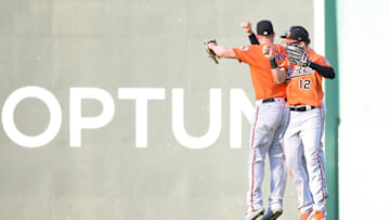 BOSTON, MA - SEPTEMBER 28: Trey Mancini #16, Austin Hays #21, and Stevie Wilkerson #12 of the Baltimore Orioles celebrate after beating the Boston Red Sox at Fenway Park on September 28, 2019 in Boston, Massachusetts. (Photo by Kathryn Riley/Getty Images)