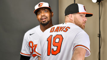 SARASOTA, FLORIDA - FEBRUARY 18: Mychal Givens #60 and Chris Davis #19 of the Baltimore Orioles pose during Photo Day at Ed Smith Stadium on February 18, 2020 in Sarasota, Florida. (Photo by Julio Aguilar/Getty Images)