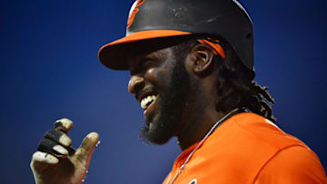 SARASOTA, FLORIDA - MARCH 10: Dwight Smith Jr. #35 of the Baltimore Orioles laughs it off after being hit by a pitch thrown by Philip Pfeifer #67 of the Atlanta Braves during the sixth inning of a Grapefruit League spring training game at Ed Smith Stadium on March 10, 2020 in Sarasota, Florida. (Photo by Julio Aguilar/Getty Images)