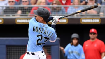 PEORIA, ARIZONA - MARCH 10: Carlos Gonzalez #27 of the Seattle Mariners follows though on a swing against the Los Angeles Angels during a spring training game at Peoria Stadium on March 10, 2020 in Peoria, Arizona. (Photo by Norm Hall/Getty Images)