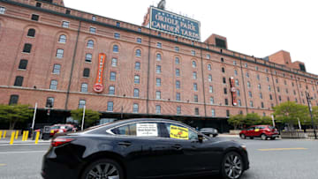 BALTIMORE, MARYLAND - MAY 14: Concession workers protest from their cars outside of Camden Yards before a protest on May 14, 2020 in Baltimore, Maryland. The group is calling for the Baltimore Orioles baseball team to pay the workers unemployment insurance benefits due to the fact the start of the MLB season has been delayed due to the Covid-19 pandemic. (Photo by Rob Carr/Getty Images)