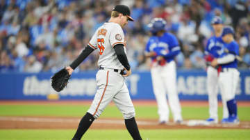 Kyle Bradish #56 of the Baltimore Orioles walks off the field. (Photo by Mark Blinch/Getty Images)