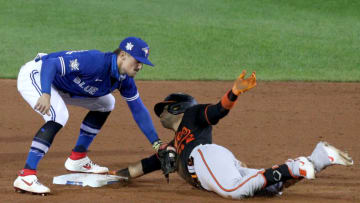 BUFFALO, NEW YORK - AUGUST 28: Cavan Biggio #42 of the Toronto Blue Jays tags Jose Iglesias #42 of the Baltimore Orioles as he slides safely into second base during the sixth inning at Sahlen Field on August 28, 2020 in Buffalo, New York. All players are wearing #42 in honor of Jackie Robinson Day. The day honoring Jackie Robinson, traditionally held on April 15, was rescheduled due to the COVID-19 pandemic. The Blue Jays are the home team and are playing their home games in Buffalo due to the Canadian government’s policy on coronavirus (COVID-19). (Photo by Bryan M. Bennett/Getty Images)