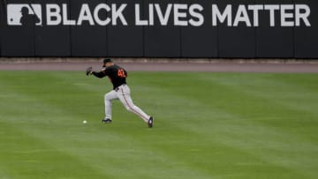BUFFALO, NEW YORK - AUGUST 29: Anthony Santander #42 of the Baltimore Orioles makes a fielding error on a ball hit by Teoscar Hernandez #42 of the Toronto Blue Jays during the first inning at Sahlen Field on August 29, 2020 in Buffalo, New York. All players are wearing #42 in honor of Jackie Robinson Day. The day honoring Jackie Robinson, traditionally held on April 15, was rescheduled due to the COVID-19 pandemic. The Blue Jays are the home team and are playing their home games in Buffalo due to the Canadian government’s policy on coronavirus (COVID-19). (Photo by Bryan M. Bennett/Getty Images)