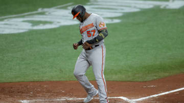 ST. PETERSBURG, FL - AUGUST 25: Hanser Alberto #57 of the Baltimore Orioles scores against the Tampa Bay Rays in the fourth inning of a baseball game at Tropicana Field on August 25, 2020 in St. Petersburg, Florida. (Photo by Mike Carlson/Getty Images)