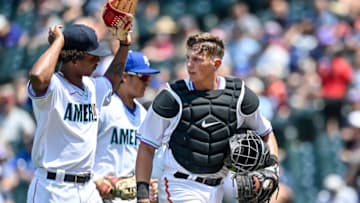DENVER, CO - JULY 11: Brayan Bello #17 has a word with Adley Rutschman #35 of American League Futures Team as they walk off the field during a game against the National League Futures Team at Coors Field on July 11, 2021 in Denver, Colorado.(Photo by Dustin Bradford/Getty Images)