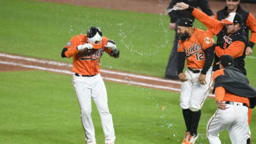 Robinson Chirinos #23 of the Baltimore Orioles is sprayed with water after Chirinos' bunt scored the winning run. (Photo by Mitchell Layton/Getty Images)