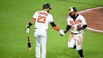 Rougned Odor #12 of the Baltimore Orioles celebrates with Robinson Chirinos #23 after scoring. (Photo by Greg Fiume/Getty Images)
