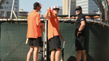 BALTIMORE, MD - JULY 23: Baltimore Orioles recent draft picks Dylan Beavers and Jud Fabian talk with manager Brandon Hyde #18 during batting practice prior to a baseball game against the New York Yankees at Oriole Park at Camden Yards on July 23, 2022 in Baltimore, Man. (Photo by Mitchell Layton/Getty Images)