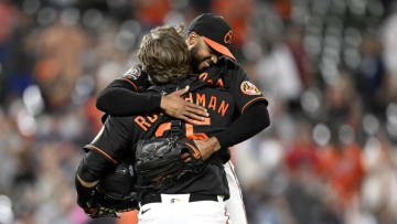 BALTIMORE, MARYLAND - SEPTEMBER 09: Dillon Tate #55 of the Baltimore Orioles celebrates with Adley Rutschman #35 after a 3-2 victory against the Boston Red Sox at Oriole Park at Camden Yards on September 09, 2022 in Baltimore, Maryland. (Photo by G Fiume/Getty Images)