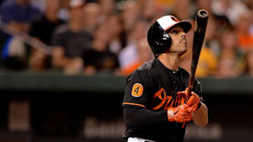 BALTIMORE, MD - AUGUST 23: Brian Roberts #1 of the Baltimore Orioles hits a grand slam against the Oakland Athletics in the fourth inning at Oriole Park at Camden Yards on August 23, 2013 in Baltimore, Maryland. (Photo by Patrick Smith/Getty Images)