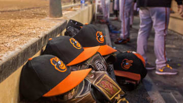 MINNEAPOLIS, MN - MAY 02: Baltimore Orioles hats and gloves on the steps of the dugout against the Minnesota Twins on May 2, 2014 at Target Field in Minneapolis, Minnesota. The Orioles defeated the Twins 3-0. (Photo by Brace Hemmelgarn/Minnesota Twins/Getty Images)