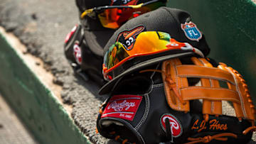 FORT MYERS, FL- MARCH 05: A Baltimore Orioles hat and Rawlings glove against the Minnesota Twins during a spring training game on March 5, 2016 at Hammond Stadium in Fort Myers, Florida. (Photo by Brace Hemmelgarn/Minnesota Twins/Getty Images) *** Local Caption ***
