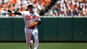 BALTIMORE, MD - JULY 24: Ryan Flaherty #3 of the Baltimore Orioles makes a throw to first base for the second out of the second inning against the Cleveland Indians at Oriole Park at Camden Yards on July 24, 2016 in Baltimore, Maryland. (Photo by Matt Hazlett/Getty Images)