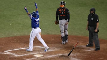 TORONTO, ON - OCTOBER 04: Edwin Encarnacion #10 of the Toronto Blue Jays reacts after hitting a three-run walk-off home run in the eleventh inning to defeat the Baltimore Orioles 5-2 in the American League Wild Card game at Rogers Centre on October 4, 2016 in Toronto, Canada. (Photo by Tom Szczerbowski/Getty Images)