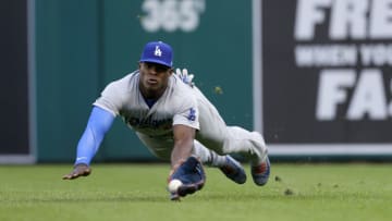 DETROIT, MI - AUGUST 18: Right fielder Yasiel Puig #66 of the Los Angeles Dodgers makes a diving catch on a fly ball hit by Nicholas Castellanos of the Detroit Tigers during the first inning at Comerica Park on August 18, 2017 in Detroit, Michigan. (Photo by Duane Burleson/Getty Images)