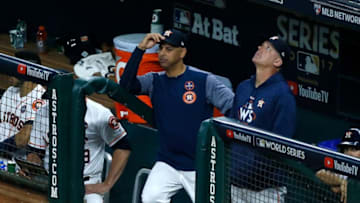HOUSTON, TX - OCTOBER 29: Bench coach Alex Cora #26 and manager A.J. Hinch #14 of the Houston Astros look on from the dugout during the fifth inning against the Los Angeles Dodgers in game five of the 2017 World Series at Minute Maid Park on October 29, 2017 in Houston, Texas. (Photo by Bob Levey/Getty Images)