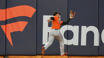 OAKLAND, CA - MAY 05: Anthony Santander #25 of the Baltimore Orioles makes a running catch to take a hit away from Marcus Semien #10 of the Oakland Athletics in the bottom of the six inning at the Oakland Alameda Coliseum on May 5, 2018 in Oakland, California. (Photo by Thearon W. Henderson/Getty Images)