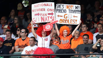 BALTIMORE, MD - MAY 28: Fans hold up signs during the Baltimore Orioles and Washington Nationals game at Oriole Park at Camden Yards on May 28, 2018 in Baltimore, Maryland. MLB players across the league are wearing special uniforms to commemorate Memorial Day.(Photo by Rob Carr/Getty Images)