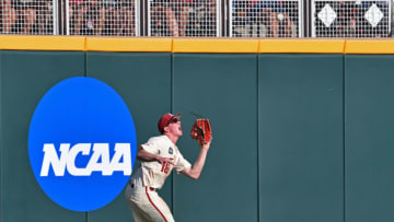 Omaha, NE - JUNE 27: Outfielder Heston Kjerstad #18 of the Arkansas Razorbacks runs in to make a catch in the second inning against the Oregon State Beavers during game two of the College World Series Championship Series on June 27, 2018 at TD Ameritrade Park in Omaha, Nebraska. (Photo by Peter Aiken/Getty Images)
