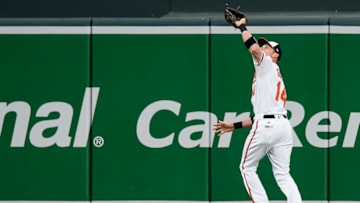 BALTIMORE, MD - AUGUST 28: Craig Gentry #14 of the Baltimore Orioles catches a fly ball off the bat of Nelson Cruz of the Seattle Mariners (not pictured) in the second inning at Oriole Park at Camden Yards on August 28, 2017 in Baltimore, Maryland. (Photo by Patrick McDermott/Getty Images.)