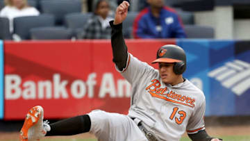 NEW YORK, NY - APRIL 30: Manny Machado #13 of the Baltimore Orioles slides home safely in the 11th inning against the New York Yankees on April 30, 2017 at Yankee Stadium in the Bronx borough of New York City.The Baltimore Orioles the New York Yankees 7-4 in 11 innings. (Photo by Elsa/Getty Images)