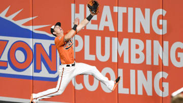 BALTIMORE, MD - SEPTEMBER 23: Austin Hays #18 of the Baltimore Orioles runs to catch a fly ball hit by Adeiny Hechavarria #11 of the Tampa Bay Rays (not pictured) in the seventh inning during a baseball game at Oriole Park at Camden Yards on September 23, 2017 in Baltimore, Maryland. (Photo by Mitchell Layton/Getty)