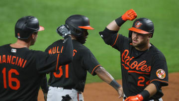 Trey Mancini #16 and Cedric Mullins #31 of the Baltimore Orioles celebrate the two run home run by DJ Stewart #24. (Photo by Richard Rodriguez/Getty Images)