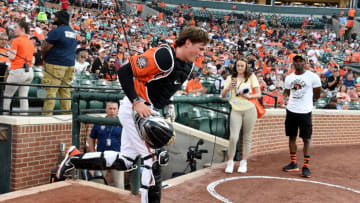 BALTIMORE, MARYLAND - MAY 21: Adley Rutschman #35 of the Baltimore Orioles takes the field in the first inning for the first time in his Major League debut against the Tampa Bay Rays at Oriole Park at Camden Yards on May 21, 2022 in Baltimore, Maryland. (Photo by G Fiume/Getty Images)