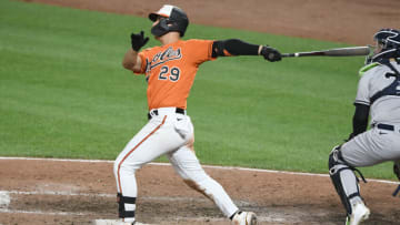 BALTIMORE, MD - JULY 23: Ramon Urias #29 of the Baltimore Orioles hits a two run home run in the eight inning during a baseball game against the New York Yankees at Oriole Park at Camden Yards on July 23, 2022 in Baltimore, Man. (Photo by Mitchell Layton/Getty Images)