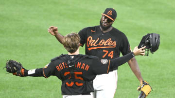 BALTIMORE, MD - AUGUST 19: Felix Bautista #74 of the Baltimore Orioles celebrates a win with Adley Rutschamn #35 after a baseball game against the Boston Red Sox at Oriole Park at Camden Yards on August 19, 2022 in Baltimore, Maryland. (Photo by Mitchell Layton/Getty Images)
