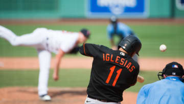 BOSTON, MA - JULY 25: Jose Iglesias #11 of the Baltimore Orioles hits a single in the seventh inning against the Boston Red Sox at Fenway Park on July 25, 2020 in Boston, Massachusetts. The 2020 season had been postponed since March due to the COVID-19 pandemic. (Photo by Kathryn Riley/Getty Images)